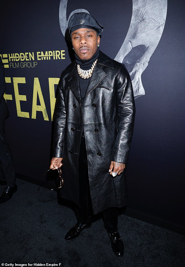 Leather dress: Rapper DaBaby, who shares a daughter with DaniLeigh, turned heads in a black leather coat