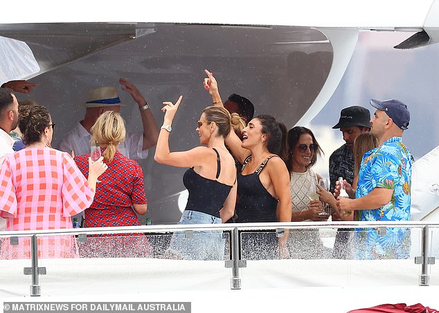 Candice, 37, wore skimpy jean shorts and a black T-shirt as she waved her hands in the air and laughed with her guests.