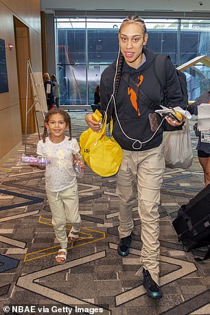 Amaya walks with her mother through a Chicago hotel during All-Star weekend in July 2022.