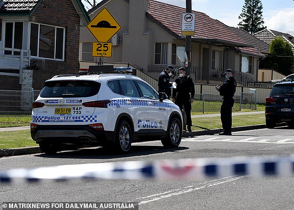 Police at the scene of the double murder of Salim and Toufik Hamze in Guildford