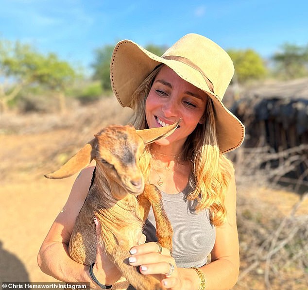 Other photos showed Elsa, 46, holding a kid and smiling while wearing a sun hat.