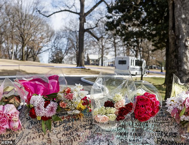 Several fans of the king of rock n' roll left flowers on the rocks outside the estate.