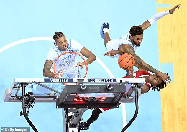 North Carolina's Leaky Black arm caught Smith in the face as he tried to block the shot.