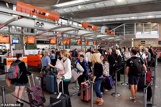 At Christmas, some cheap airfares from Australia to London cost as much as $6,000, putting it out of reach for most people.  Pictured: Sydney airport check-in queue