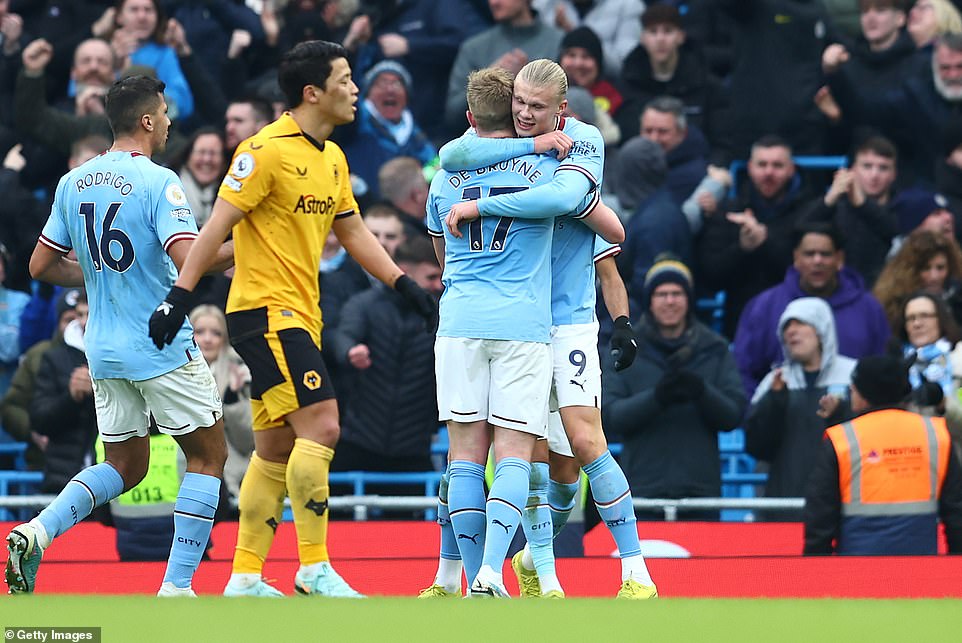 Haaland (right) stepped up to take the penalty kick and put Man City 2-0 up on 50 minutes, firing the ball past José Sa into the net.