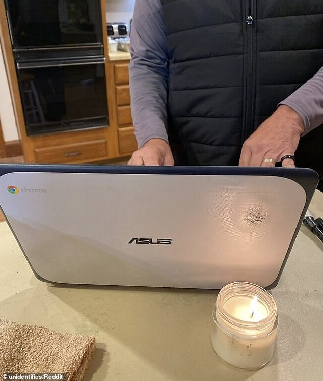 This dad was confused because the top left corner of his screen was blurry, only to realize that a candle had stuck to the back of the laptop.