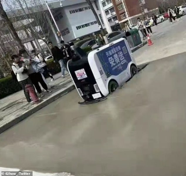 The computer says no: An unmanned delivery robot in China crashed into wet concrete and got stuck while delivering food