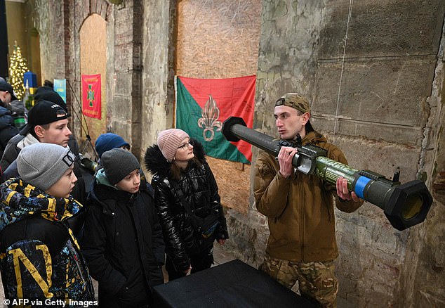 Ukrainian military demonstrates an anti-tank missile system to children during an interactive exhibition "weapons of victory" where samples of the different anti-tank weapons are displayed, including NLAW and Javelin