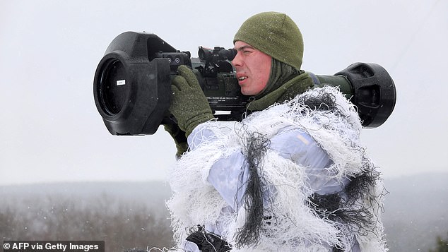 A serviceman of the Military Forces of Ukraine takes aim with a Swedish-British Next Generation Light Anti-Tank Weapon (NLAW) anti-aircraft missile launcher