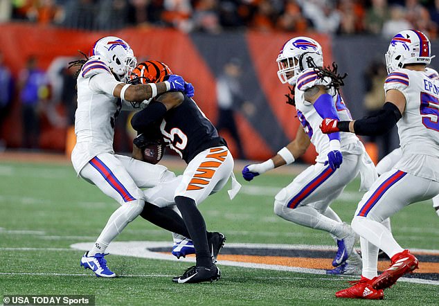 Hamlin (left) went into cardiac arrest after a tackle against the Bengals on January 2.