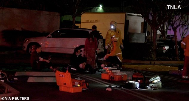 Firefighters were seen treating the injured in the parking lot outside the dance studio on Saturday night.