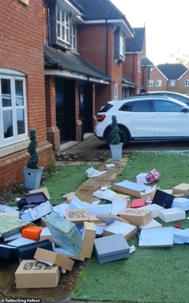 In the video, a large pile of what appear to be shoe boxes can be seen on the ground outside the front of the house.