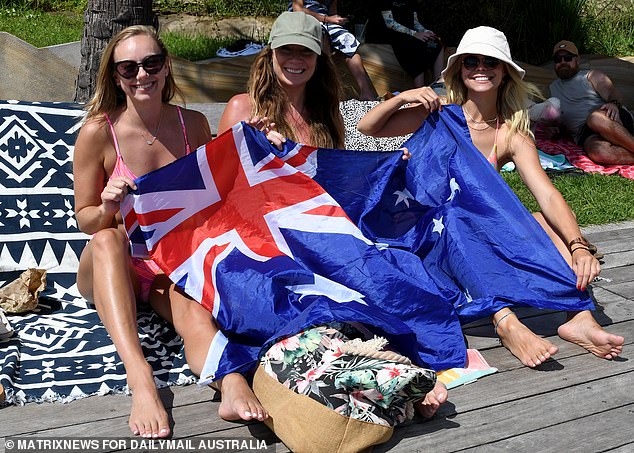 Kmart has joined other major companies in offering employees the option to trade time off on January 26 for another day to celebrate Australia Day (Australia Day revelers in Sydney last year pictured)