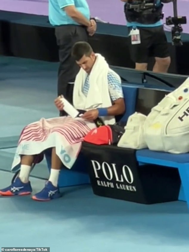 Djokovic took the time to carefully read the label on the bottle, with some suggesting that it contained training notes from his team.