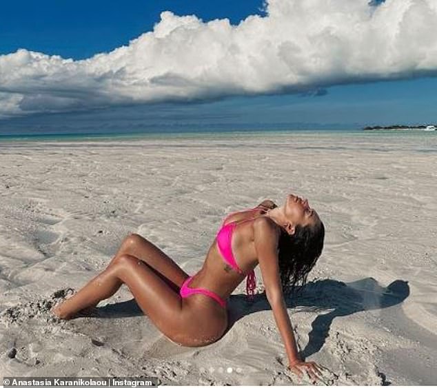 Sexy: Anastasia posed in some sexy poses on the sand and in the water for the snap carousel