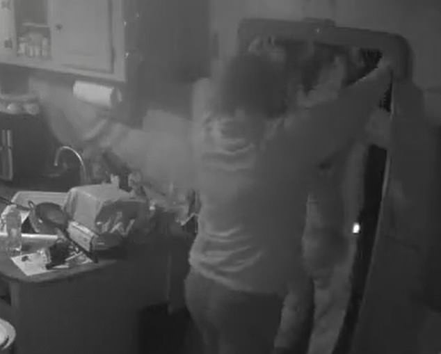 Kloepfer can be seen on surveillance footage from inside the trailer opening the door with his wife Alison Mahler shortly behind him.  Both of his hands rose