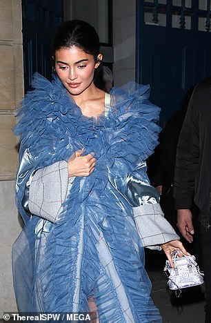 Showstopper: The billionaire businesswoman, 25, turned heads as she headed to the designer show on Sunday.