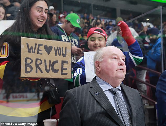 Head coach Bruce Boudreau of the Vancouver Canucks looks on from the bench during their NHL game against the Edmonton Oilers at Rogers Arena on January 21, 2023 in Vancouver.