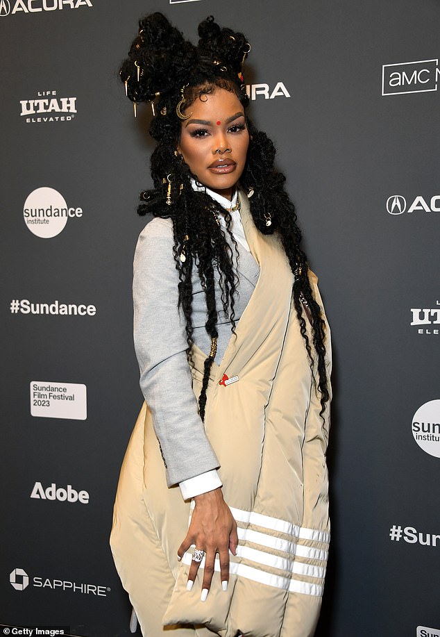 Beautiful: With her lustrous hair bundled in a stunning array of stunning curls, Teyana turned heads when she arrived with her beautiful family.