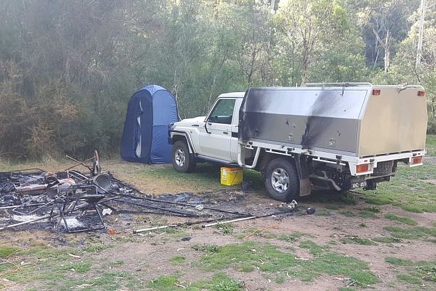 The charred remains of the Russell Hill camp after his alleged murder