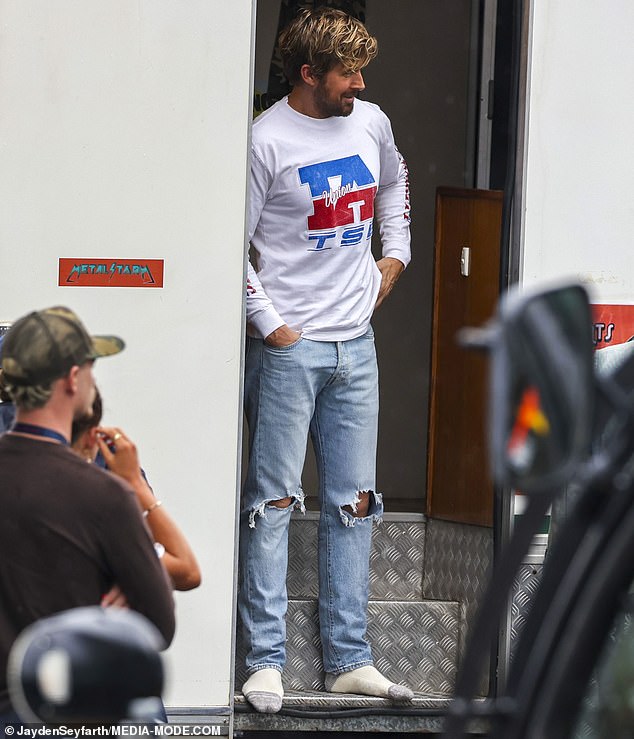 At one point, Gosling relaxed and kicked off his boots, still sporting a bit of fake blood on his face from the last scene.