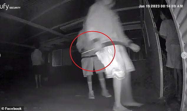 An owner's security camera caught this person with a knife as a group of children barged in, unperturbed by the alarm, ate their food and watched TV before vandalizing the place.