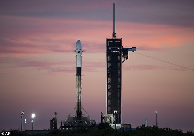 A SpaceX Falcon 9 rocket carrying NASA's Imaging X-ray Polarimetry Explorer (IXPE) spacecraft is seen at sunset on the launch pad at Launch Complex 39A at Cape Canaveral, in December 2021.