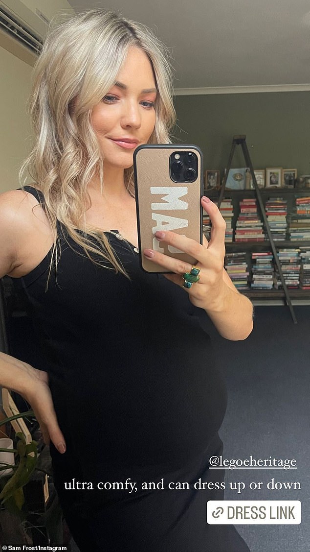 The former Home and Away star, 33, flaunted her bump in a black dress from the range, explaining that it was 