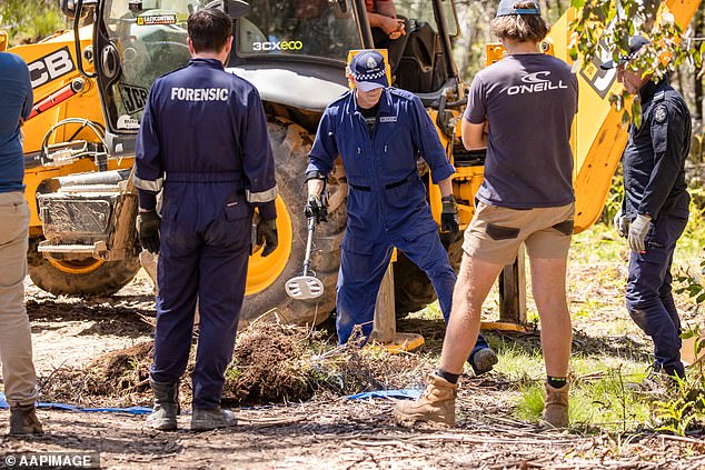 Victoria Police and forensics search for the remains of missing campers Russell Hill and Carol Clay in the bushland north of Dargo Victoria on November 30, 2021