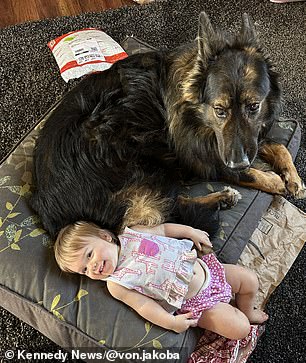 Laid river with one of the puppies.