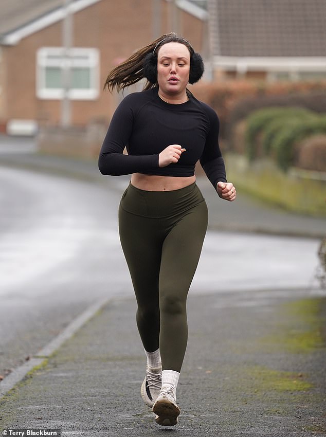 Working up a sweat: The Geordie Shore star, 32, showed off her midriff in a black crop top which she teamed with a pair of khaki leggings