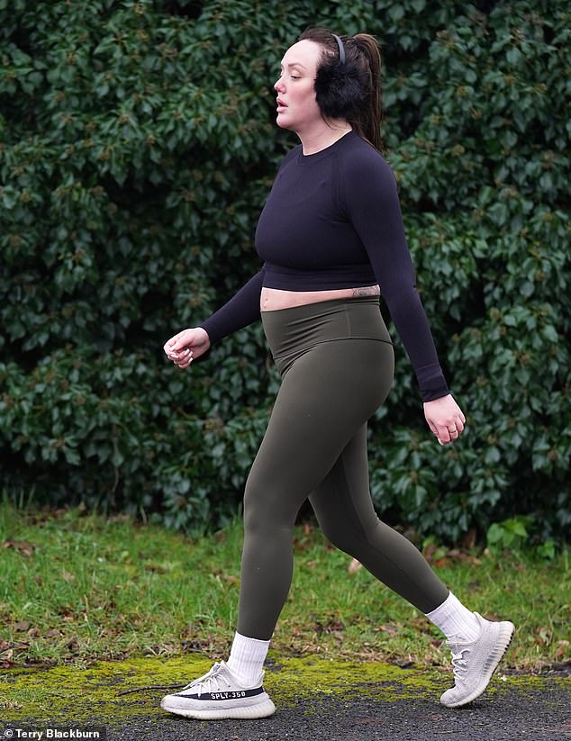 Unbelievable: Charlotte rocked a pair of white sneakers and tucked her figure-hugging leggings into long socks for her run