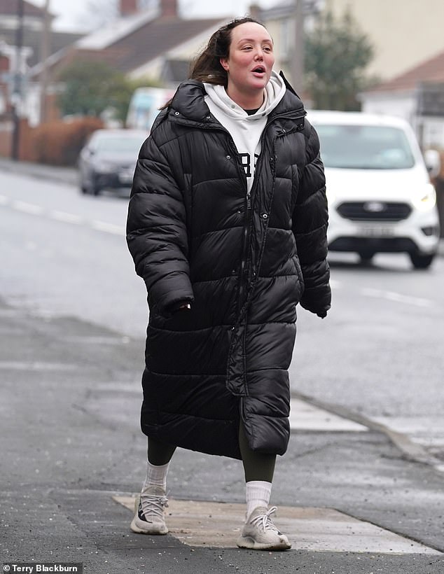 Worn out: After working out, the TV personality dressed in a white hoodie and long black puffer jacket