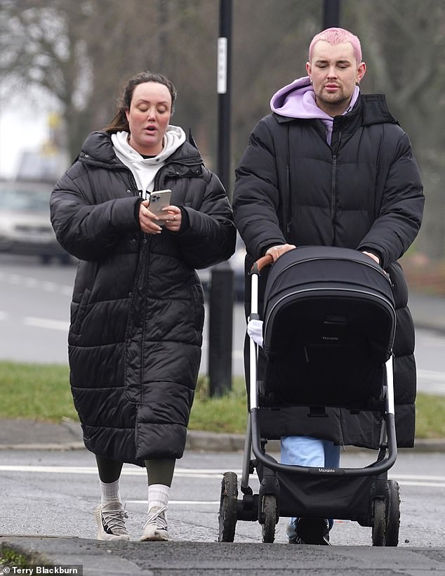 Friend: She was seen checking her phone when she was joined by a friend pushing a stroller.