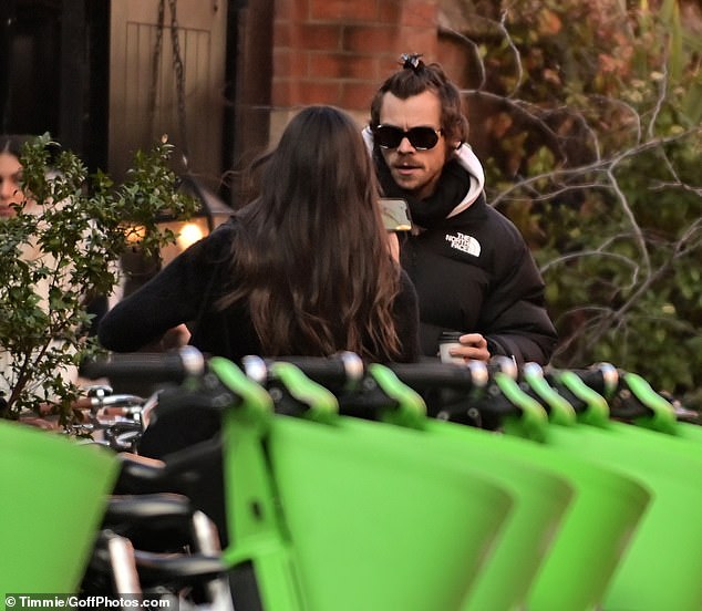 Concentration: The couple appeared to be deep in conversation when they were photographed saying goodbye