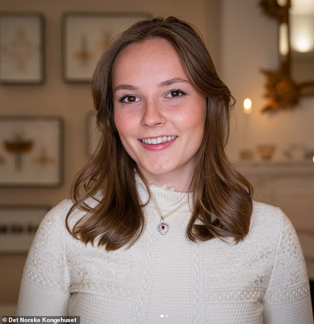 Another photograph captured the princess (pictured) dressed in a cream-colored knit sweater, teamed with a dazzling silver heart pendant on a string of pearls.