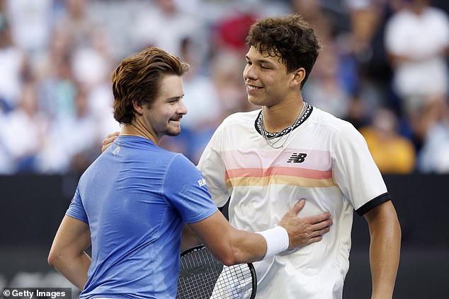 The two Americans embrace at the net after their nearly four-hour epic at the Australian Open.