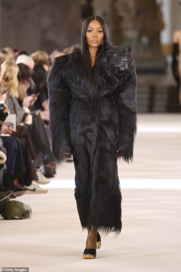 Bonus: Naomi's garment had a wacky shoulder pad design and featured a furry fabric hem while the animal's head sat on the left neck.