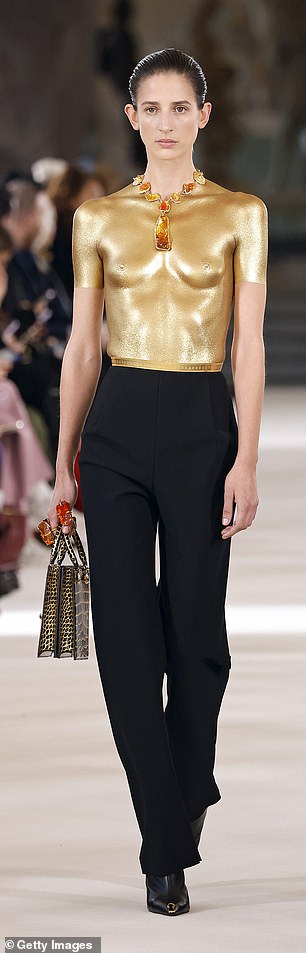 Color Combination: While a black and gold theme was followed with all the garments modeled on the runway.