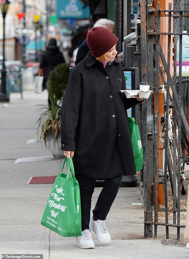 Style: The 37-year-old singer's lighter, cropped locks could be seen peeking out from under her hat as she went about her day during a casual outing on the town in USA