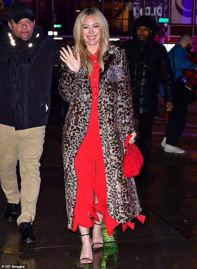 Stunning: The 35-year-old actress looked stunning in an ankle-length animal print coat over a red skirt and blouse when she arrived for a chat with GMA host Lara Spencer