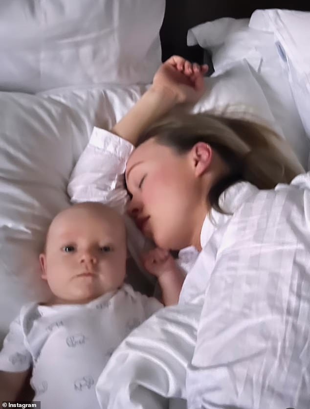 Making memories: In another, she sleeps while her son naps next to her