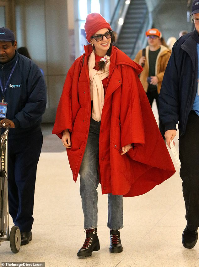 Cosy: Sporting an oversized jacket, matching beanie and oversized sunglasses, the 40-year-old actress, who spent the weekend promoting her new movie Eileen, beamed at viewers ahead of her flight home .