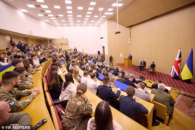 Former British Prime Minister Boris Johnson and Ukrainian President Volodymyr Zelenskiy address students in Kyiv.