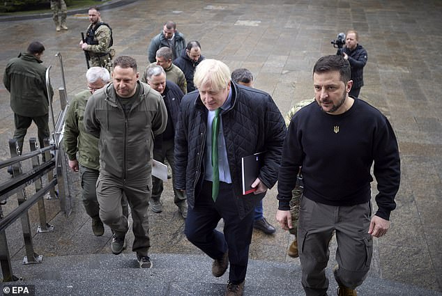 A photo provided by Ukraine's presidential press service shows Ukrainian President Volodymyr Zelensky (R) welcoming former British Prime Minister Boris Johnson (L) for a meeting in Kyiv, Ukraine, January 22, 2022 amid the Russian invasion.