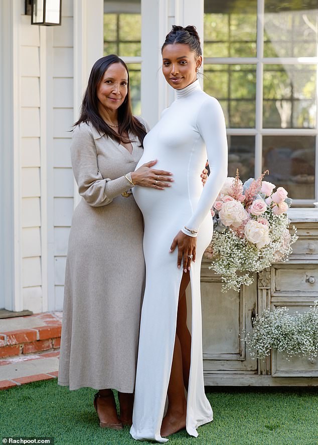 Full circle: Tookes posed with her mother Cary Robinson, who lovingly wrapped her hands around her daughter