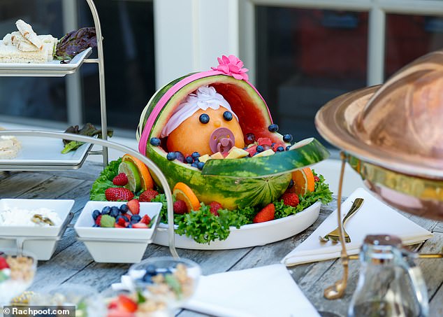 Lovely!  A baby in a stroller was created for a fruit tray using a neatly cut watermelon