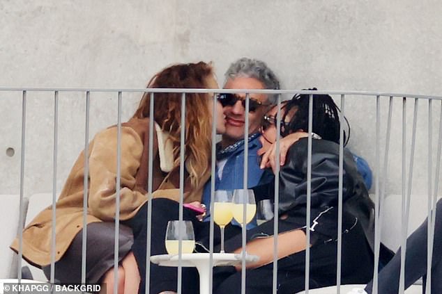 Just friends!  In footage taken in May 2021, Rita and Taika are seen smoking and drinking on a Sydney balcony with the 39-year-old Creed star.