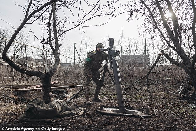 A Ukrainian soldier practices with a mortar at his mortar position heading towards Bakhmut, Ukraine, as military mobility continues in the Russo-Ukrainian war on January 21, 2023.