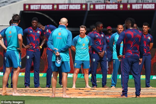 Players from the West Indies and Australia take part in a barefoot circle ahead of the Test series between the two sides in November.  The indigenous practice has now become commonplace in Australian cricket.